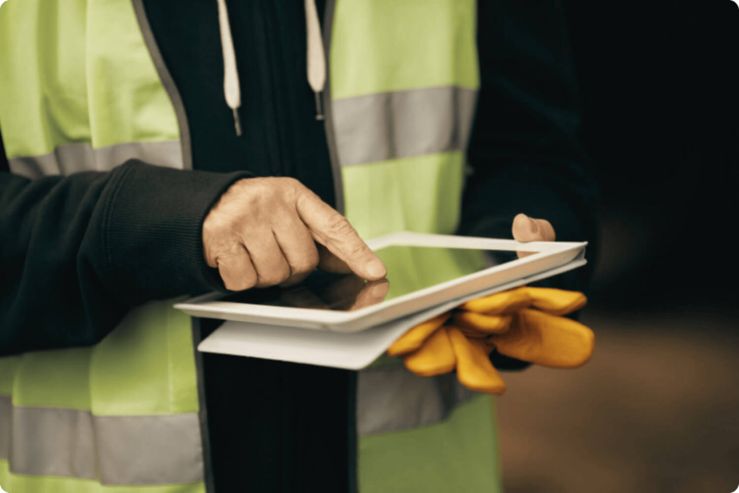 Worker pointing at a tablet screen