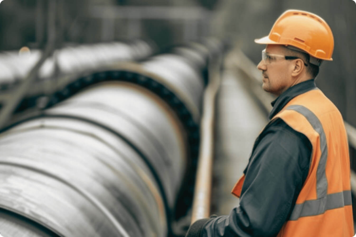 Photo of man overseeing pipelines