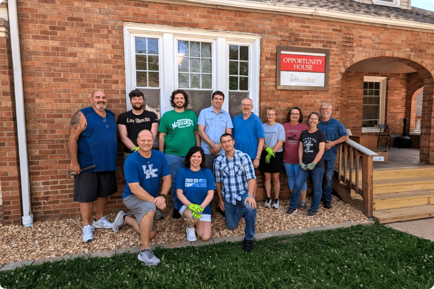 Photo of a group of employees volunteering at Opportunity House