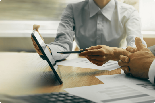 Man presenting on tablet holding a stylus